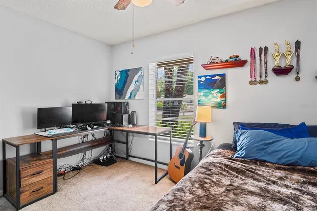 a bedroom with furniture and a window
