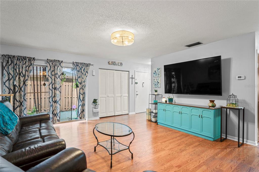 802 Antler Court Brandon, FL 33511 - Photo 2 of 37 a living room with furniture and a flat screen tv