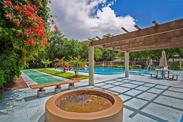 a view of a backyard with sitting area