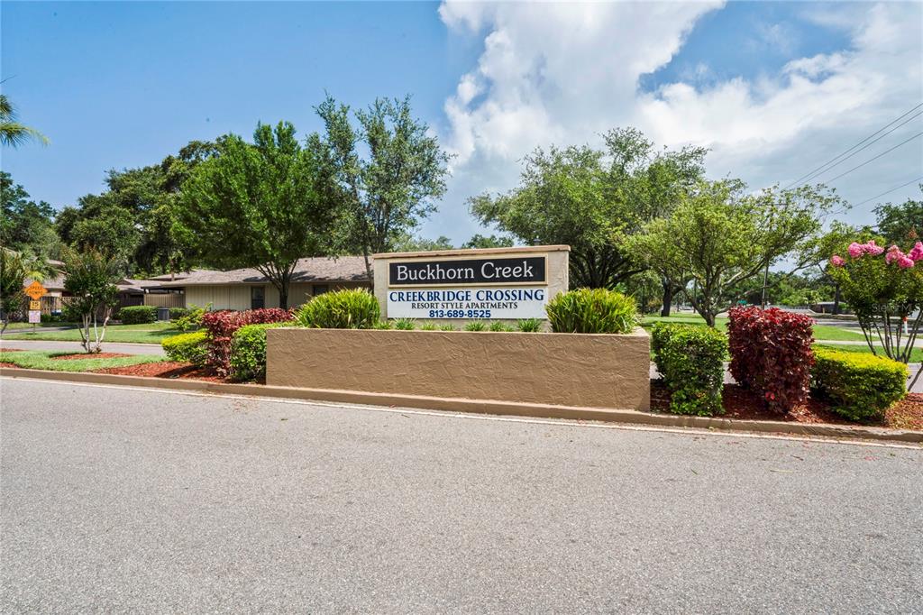 802 Antler Court Brandon, FL 33511 - Photo 36 of 37 a view of a street with a bench and trees