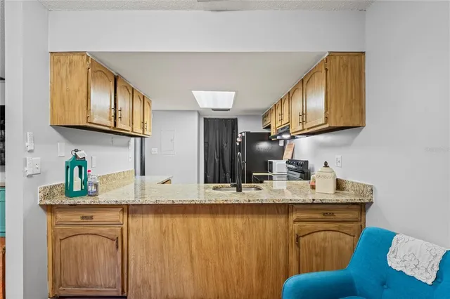 a bathroom with a sink a mirror and cabinets