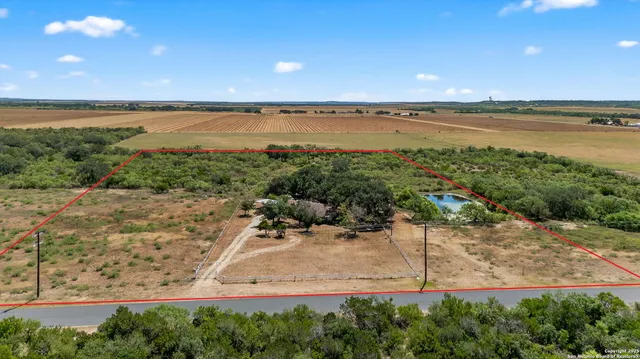 a view of an ocean beach and a yard