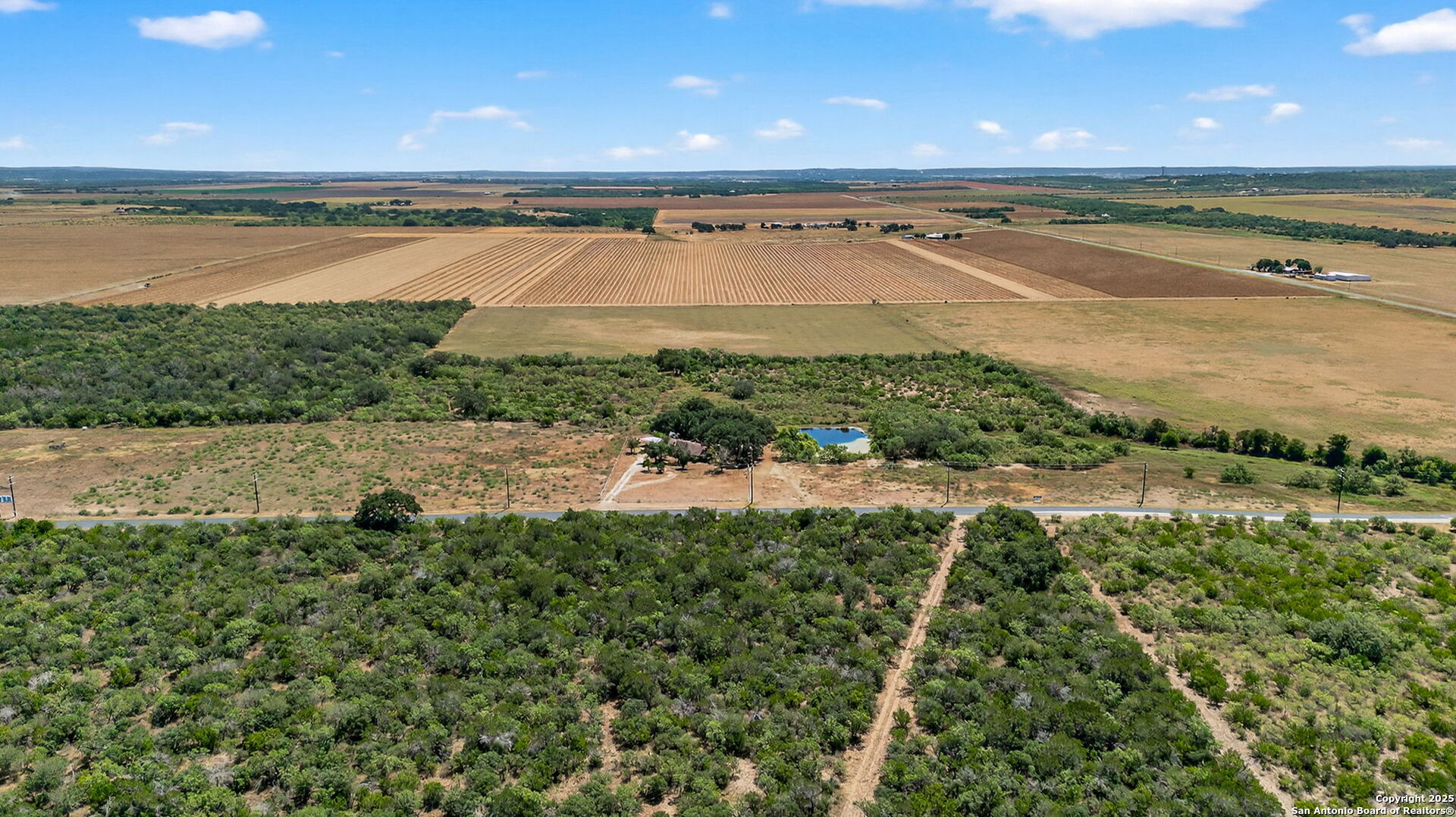 281 County Road 265 Mico, TX 78056 - Photo 14 of 28 a view of a lake with a yard
