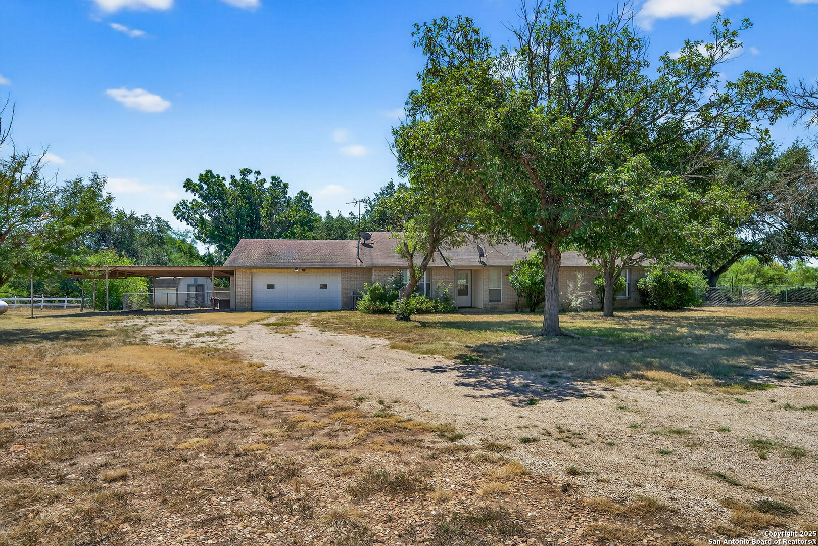 281 County Road 265 Mico, TX 78056 - Photo 21 of 28 a house view with a outdoor space