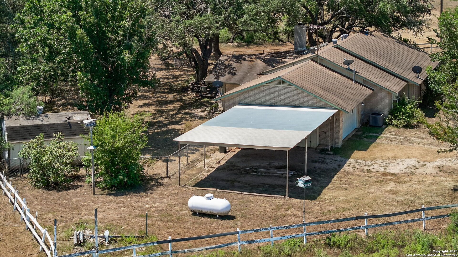 281 County Road 265 Mico, TX 78056 - Photo 22 of 28 a view of a terrace with wooden fence
