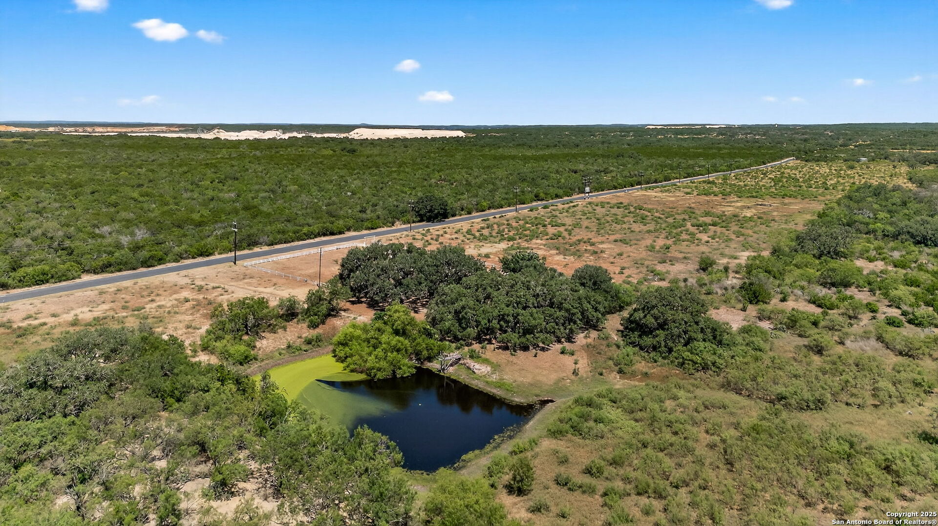 281 County Road 265 Mico, TX 78056 - Photo 5 of 28 a view of a lake with a yard