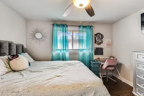 a bedroom with a bed and cabinets