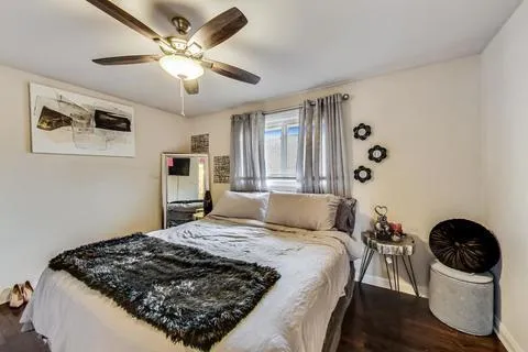 a bedroom with a bed and a stove