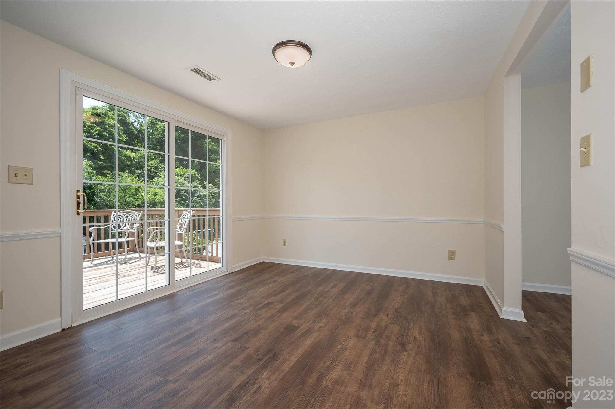 980 Brookside Camp Road Hendersonville, NC 28792 - Photo 13 of 47 wooden floor in an empty room with a window