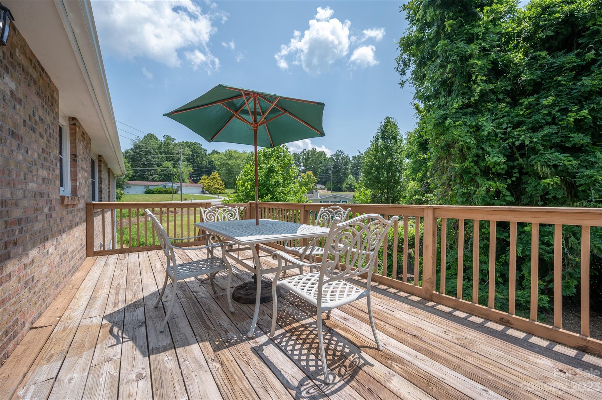 980 Brookside Camp Road Hendersonville, NC 28792 - Photo 15 of 47 a view of balcony with wooden floor and outdoor seating
