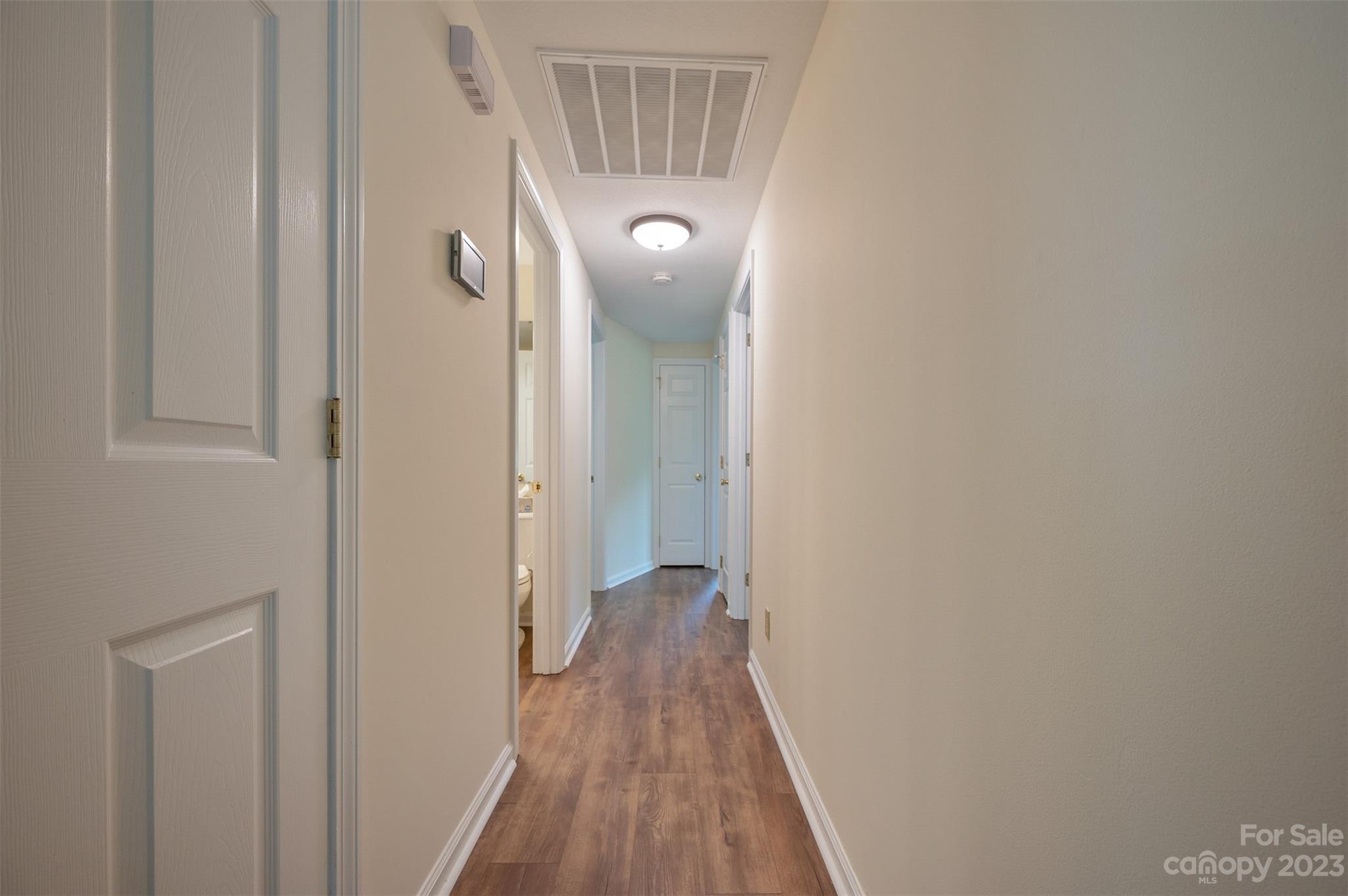 980 Brookside Camp Road Hendersonville, NC 28792 - Photo 18 of 47 a view of a hallway with wooden floor