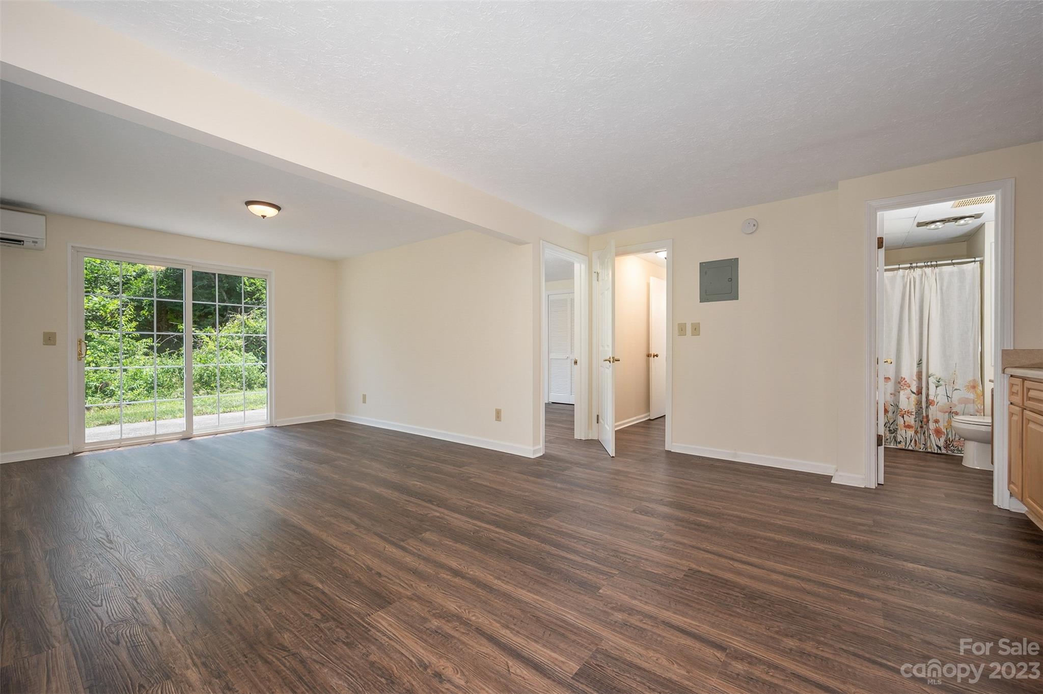 980 Brookside Camp Road Hendersonville, NC 28792 - Photo 29 of 47 a view of empty room with wooden floor and fan