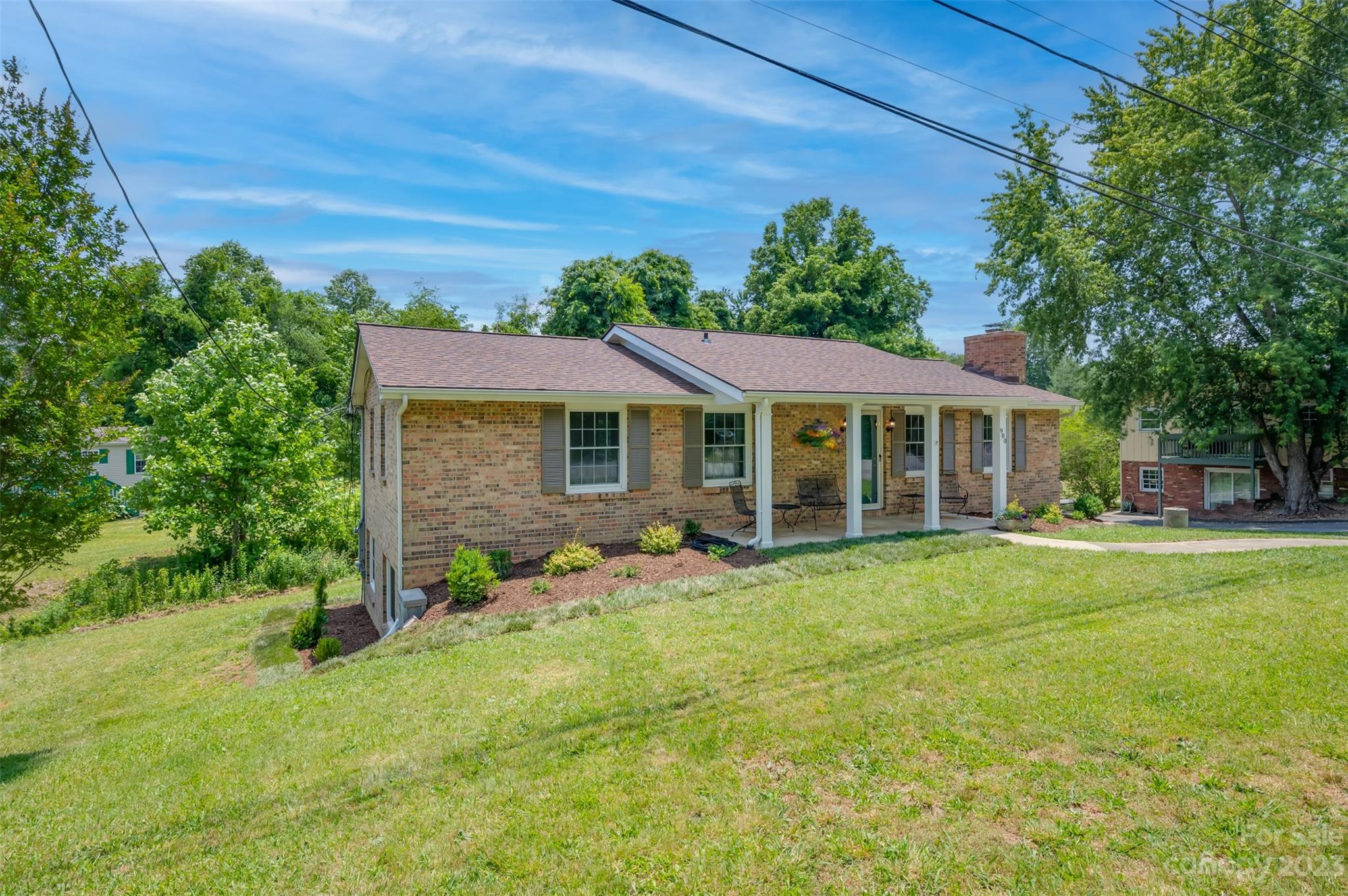 980 Brookside Camp Road Hendersonville, NC 28792 - Photo 3 of 47 front view of a house with a yard