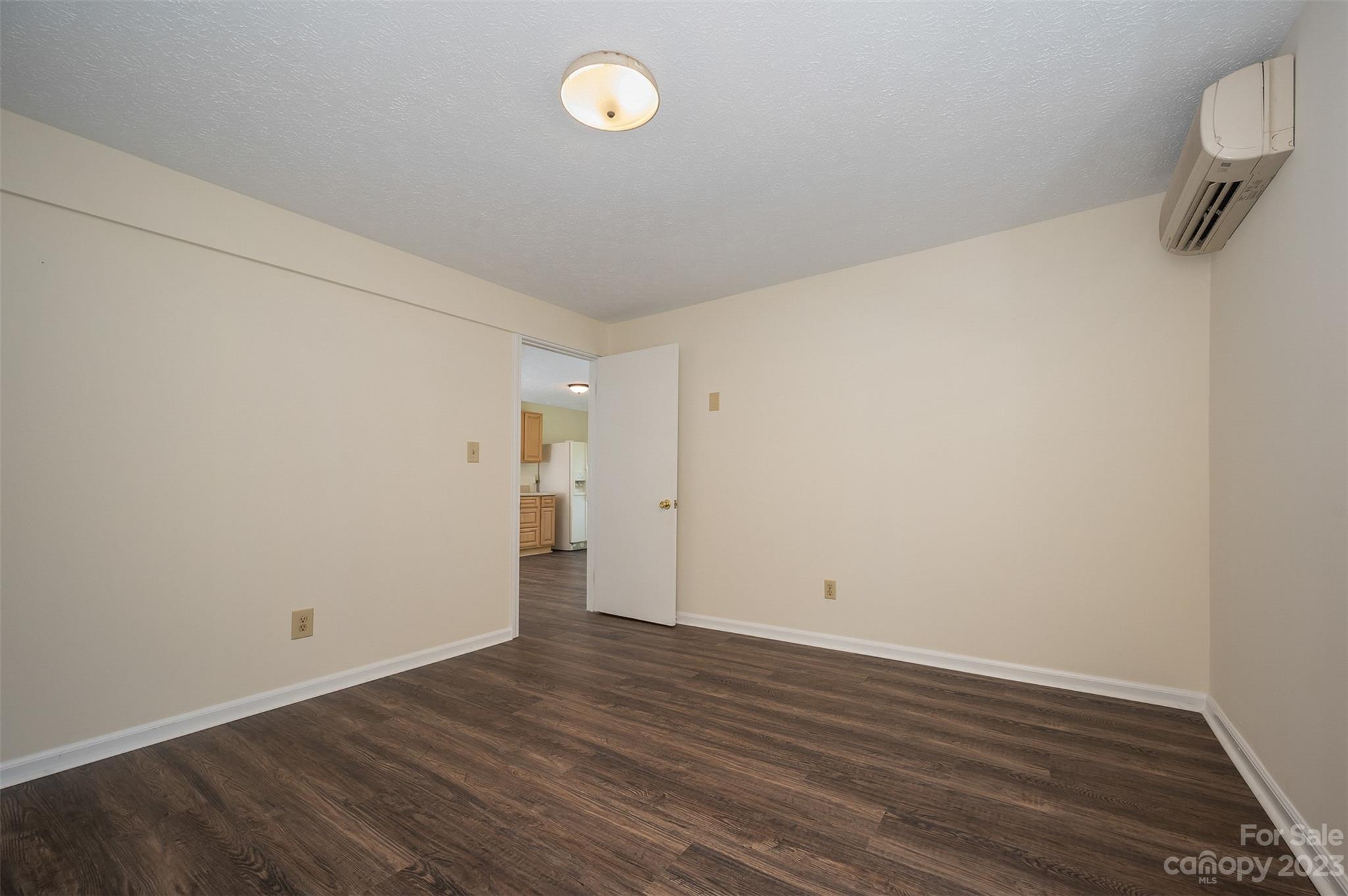 980 Brookside Camp Road Hendersonville, NC 28792 - Photo 34 of 47 a view of a room with wooden floor