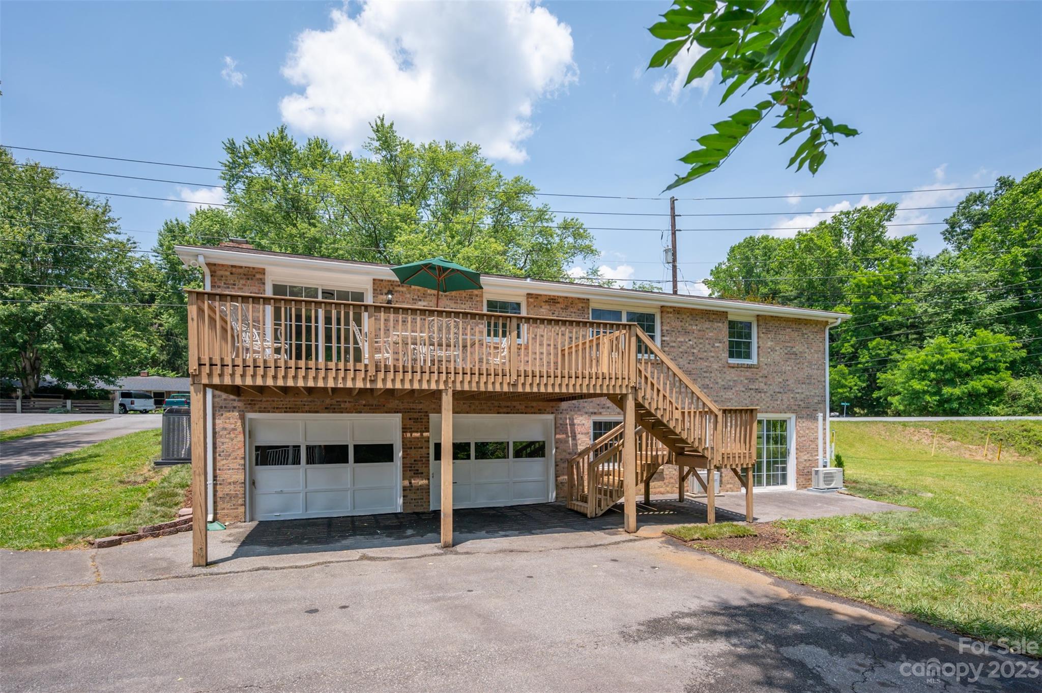 980 Brookside Camp Road Hendersonville, NC 28792 - Photo 37 of 47 a view of a house with a balcony
