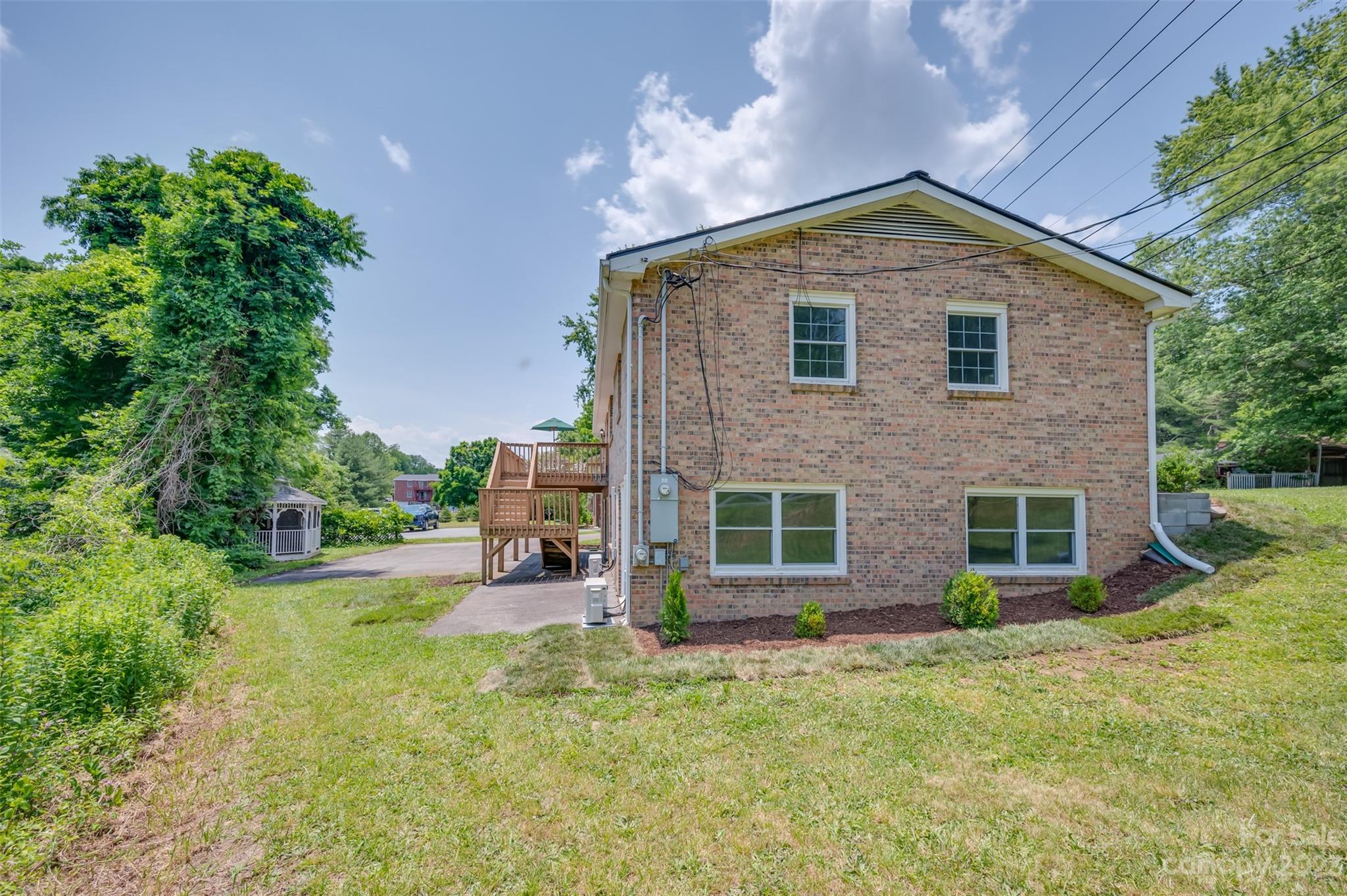 980 Brookside Camp Road Hendersonville, NC 28792 - Photo 38 of 47 a front view of a house with a yard