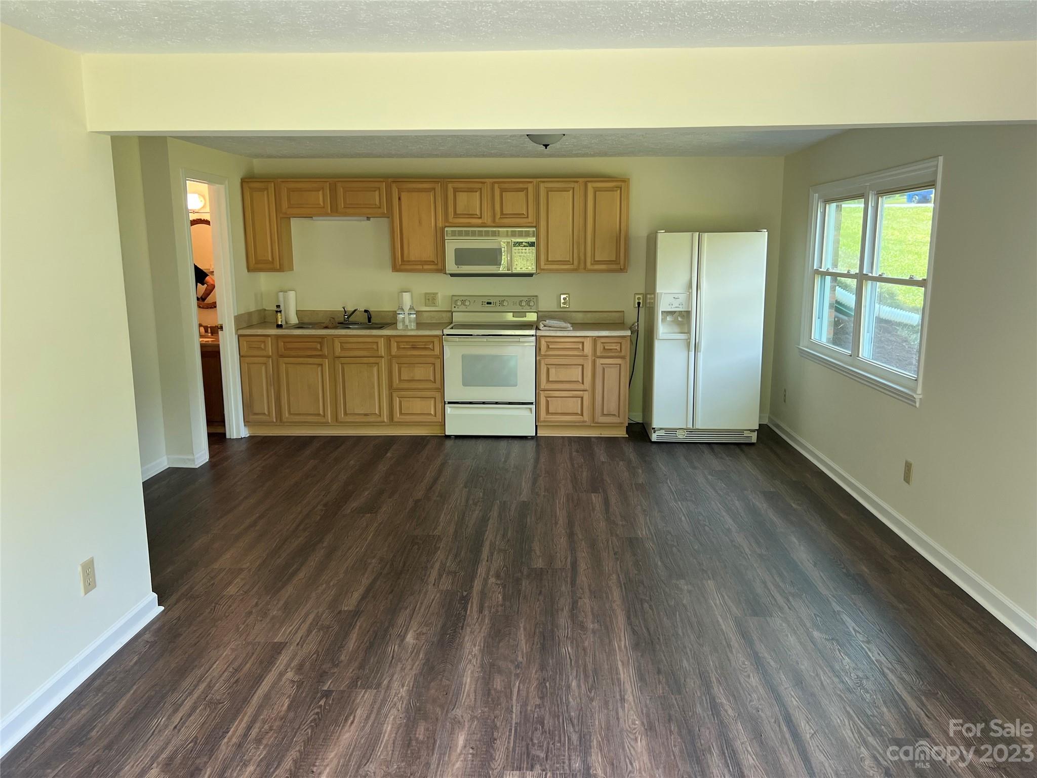 980 Brookside Camp Road Hendersonville, NC 28792 - Photo 40 of 47 a view of a kitchen with wooden floor and a sink