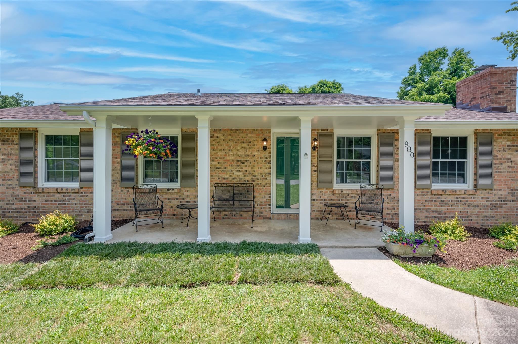 980 Brookside Camp Road Hendersonville, NC 28792 - Photo 6 of 47 front view of a house with a yard