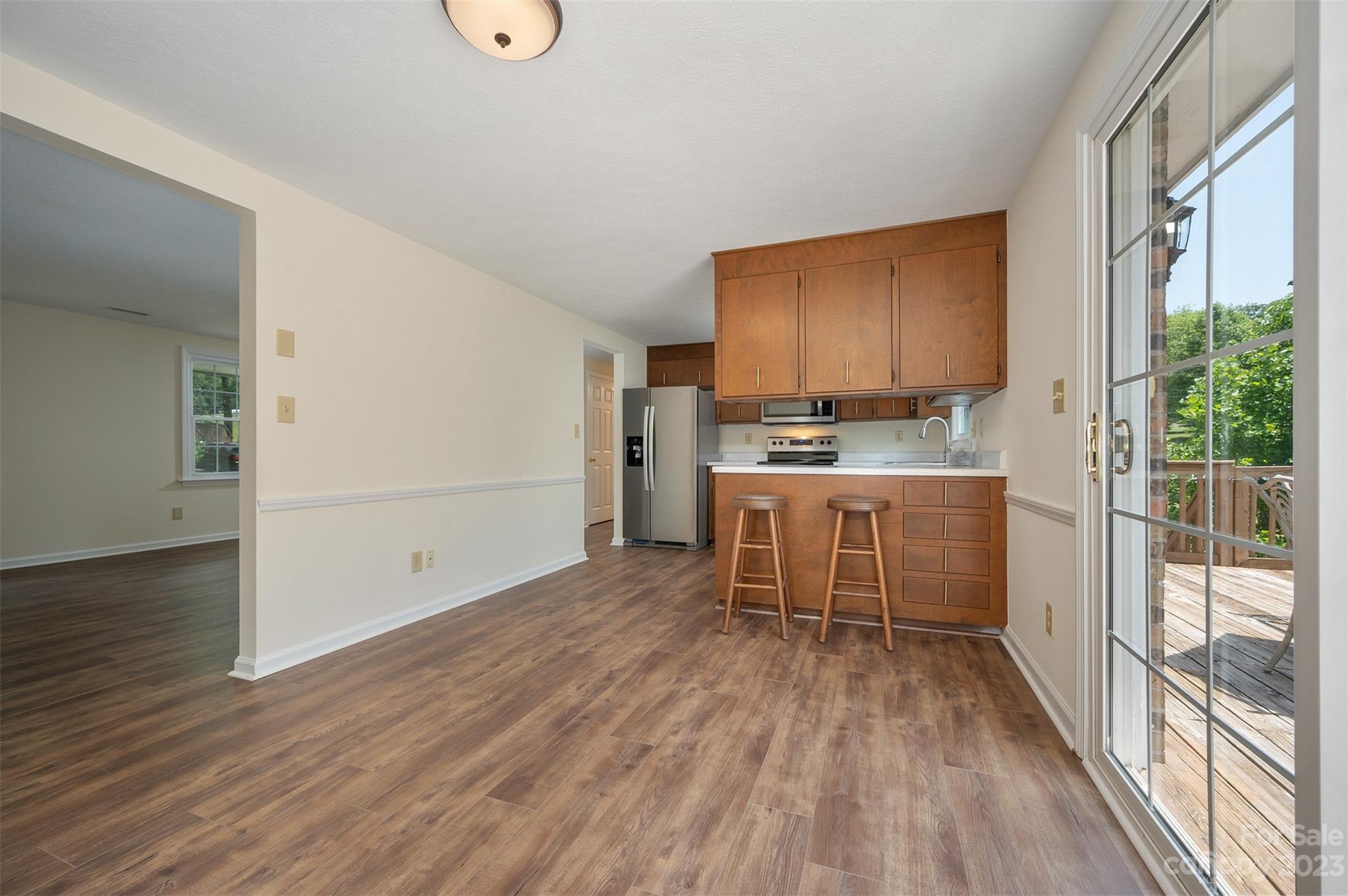 980 Brookside Camp Road Hendersonville, NC 28792 - Photo 10 of 47 a kitchen with stainless steel appliances a stove top oven a sink and a refrigerator