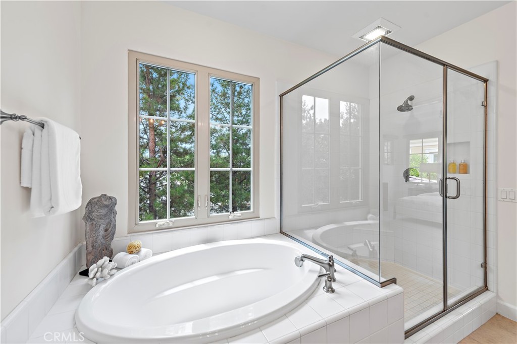 22 Tesoro Irvine, CA 92618 - Photo 11 of 27 a bathroom with a tub and shower