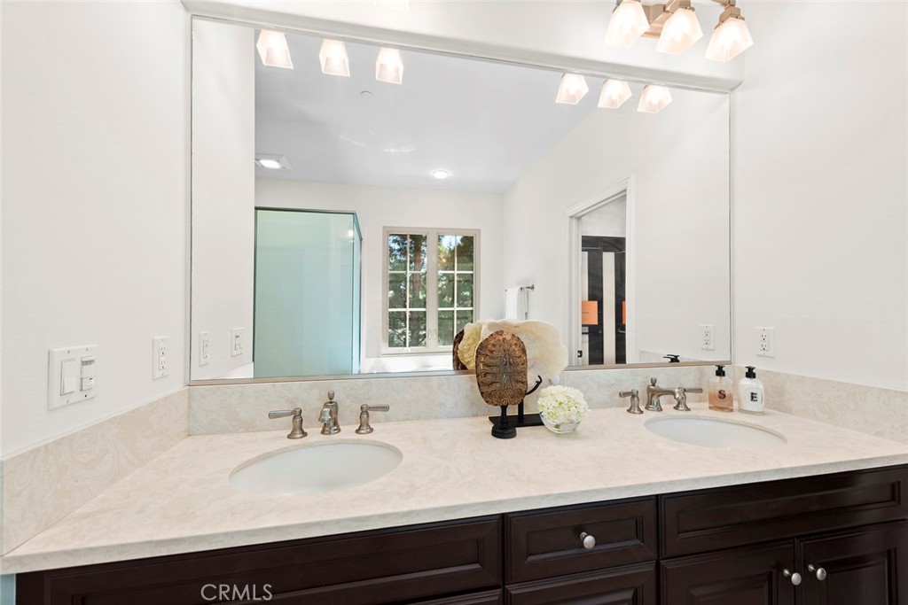22 Tesoro Irvine, CA 92618 - Photo 12 of 27 a bathroom with a sink double vanity and a mirror