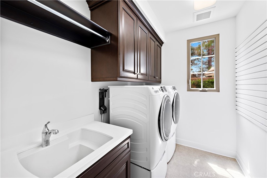 22 Tesoro Irvine, CA 92618 - Photo 15 of 27 a bathroom with a sink and mirror