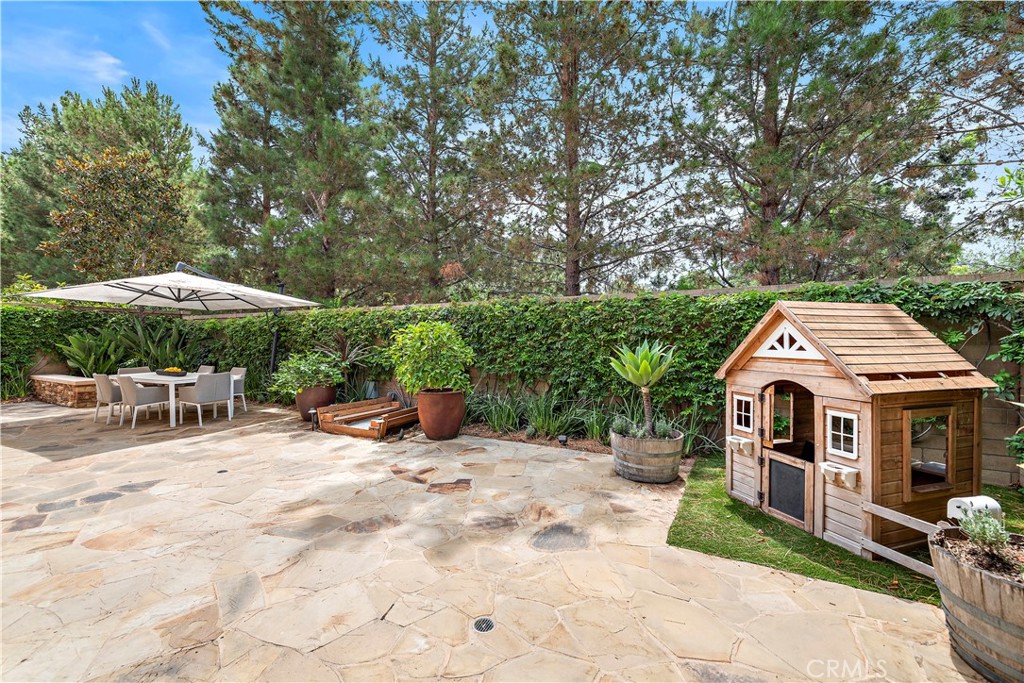 22 Tesoro Irvine, CA 92618 - Photo 17 of 27 an outdoor space with furniture and umbrella