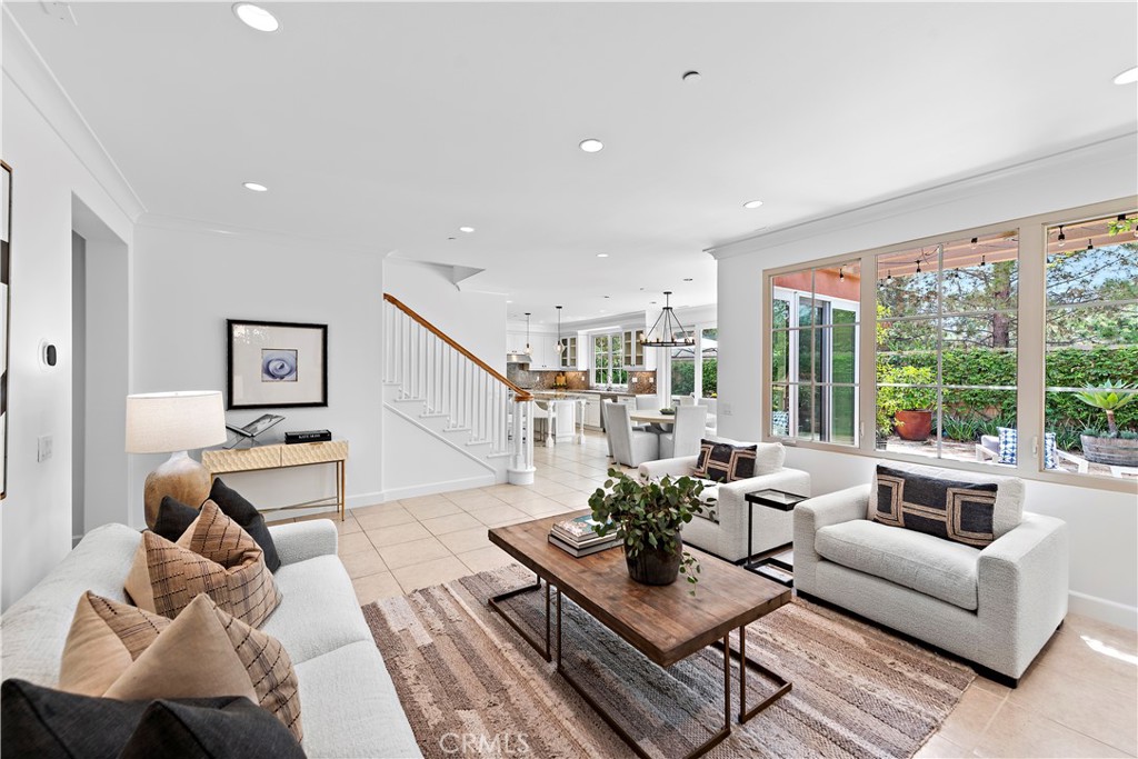 22 Tesoro Irvine, CA 92618 - Photo 3 of 27 a living room with furniture city view and large windows