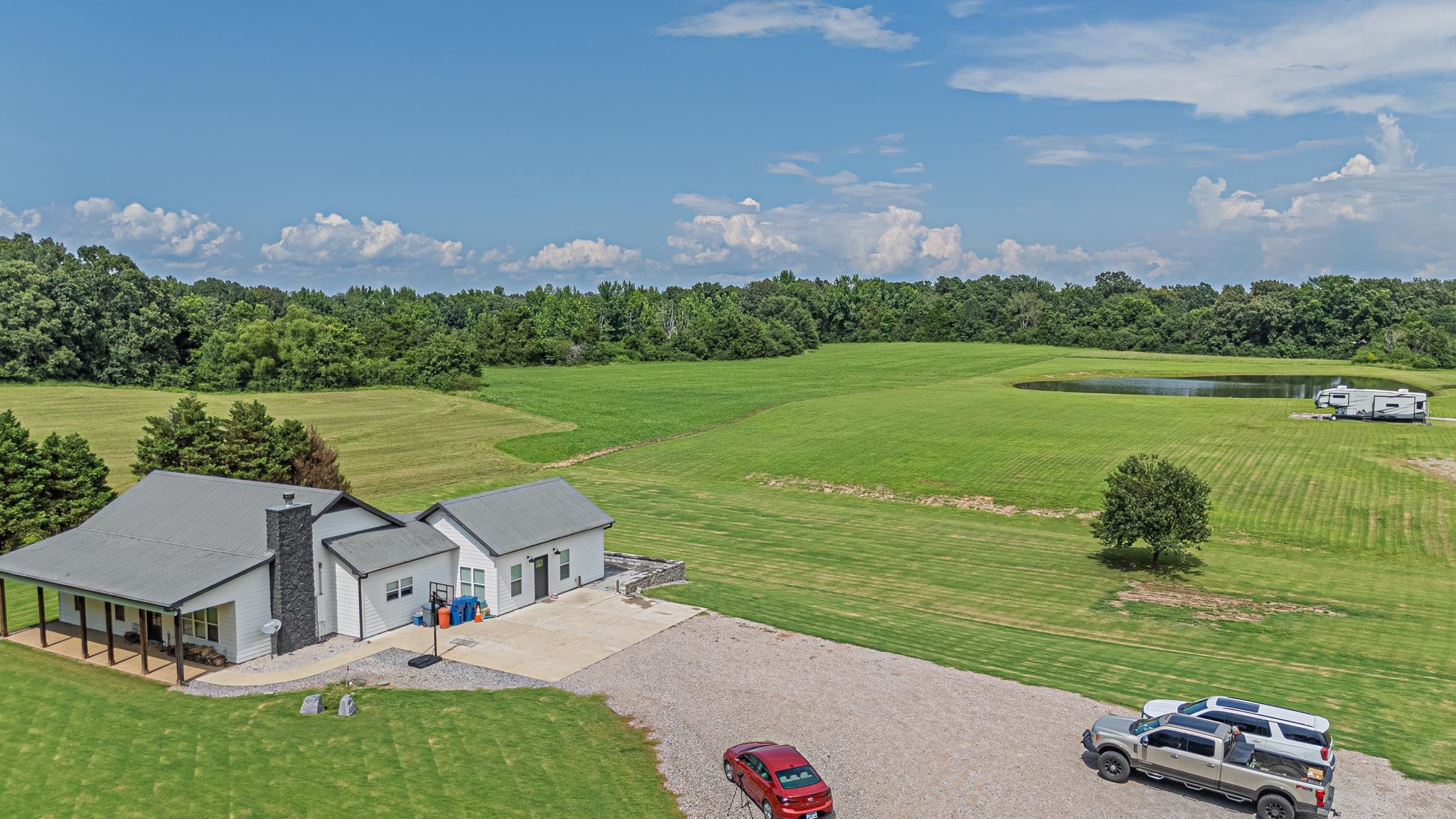 an aerial view of a house with outdoor space swimming pool and mountains
