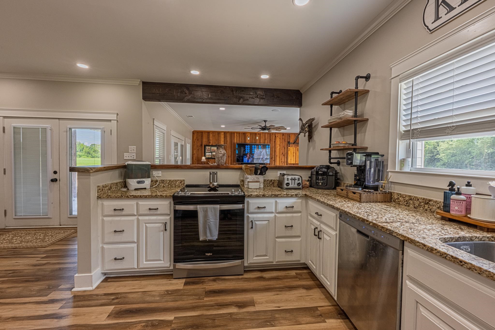50 Shady Grove Road Williston, TN 38076 - Photo 18 of 35 a large kitchen with stainless steel appliances granite countertop a stove and a sink