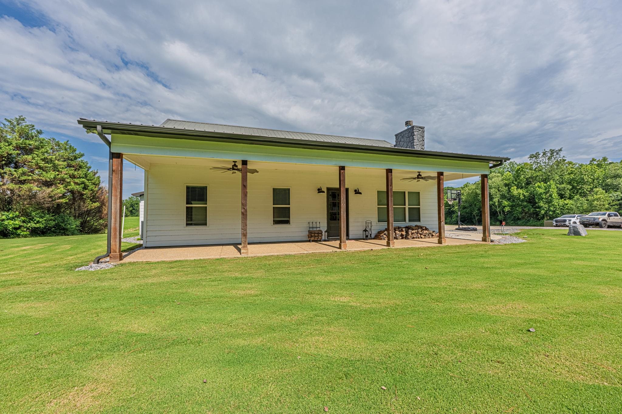 50 Shady Grove Road Williston, TN 38076 - Photo 3 of 35 a backyard of a house with table and chairs