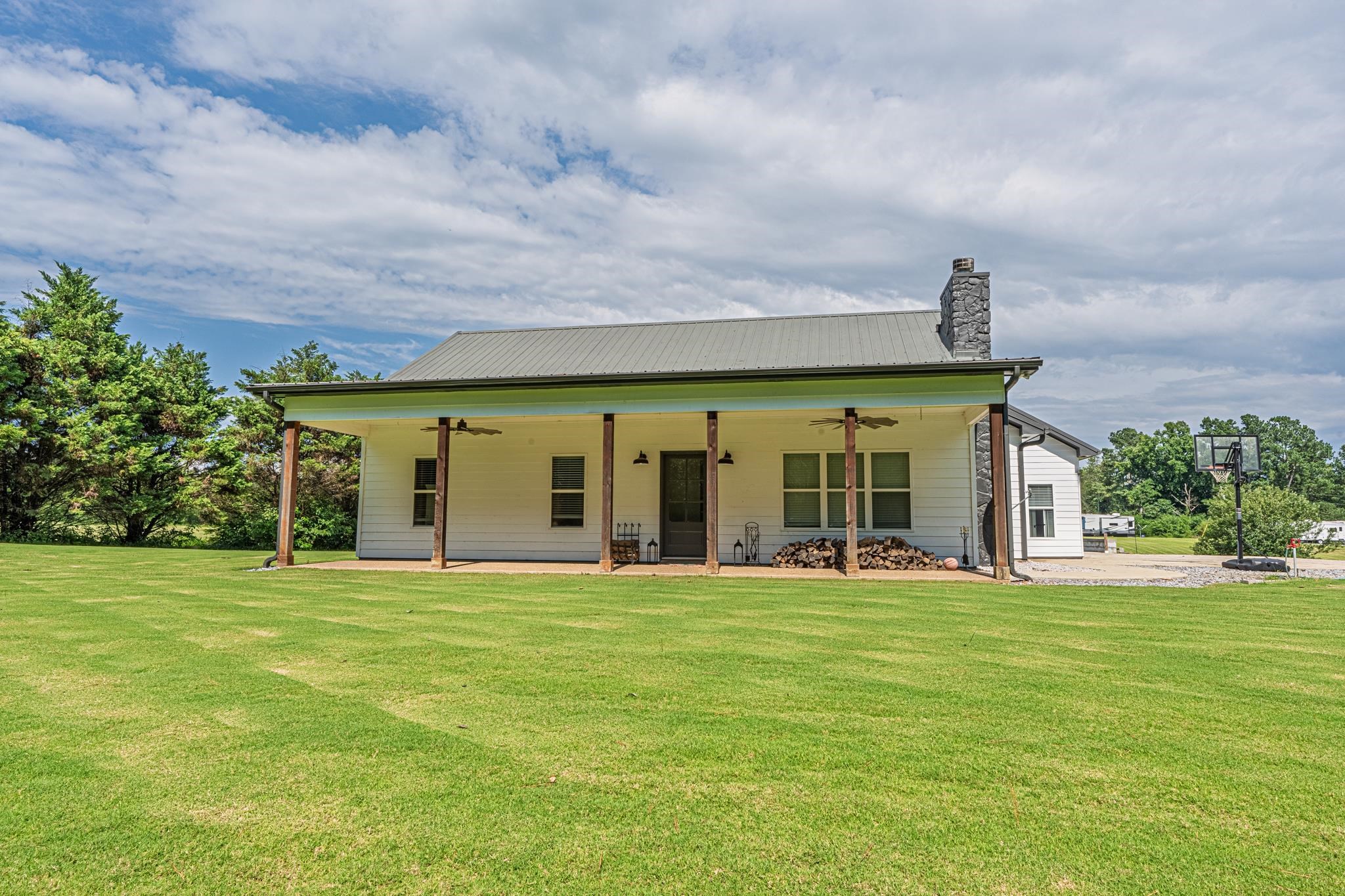50 Shady Grove Road Williston, TN 38076 - Photo 4 of 35 a view of a large building with a big yard and large trees