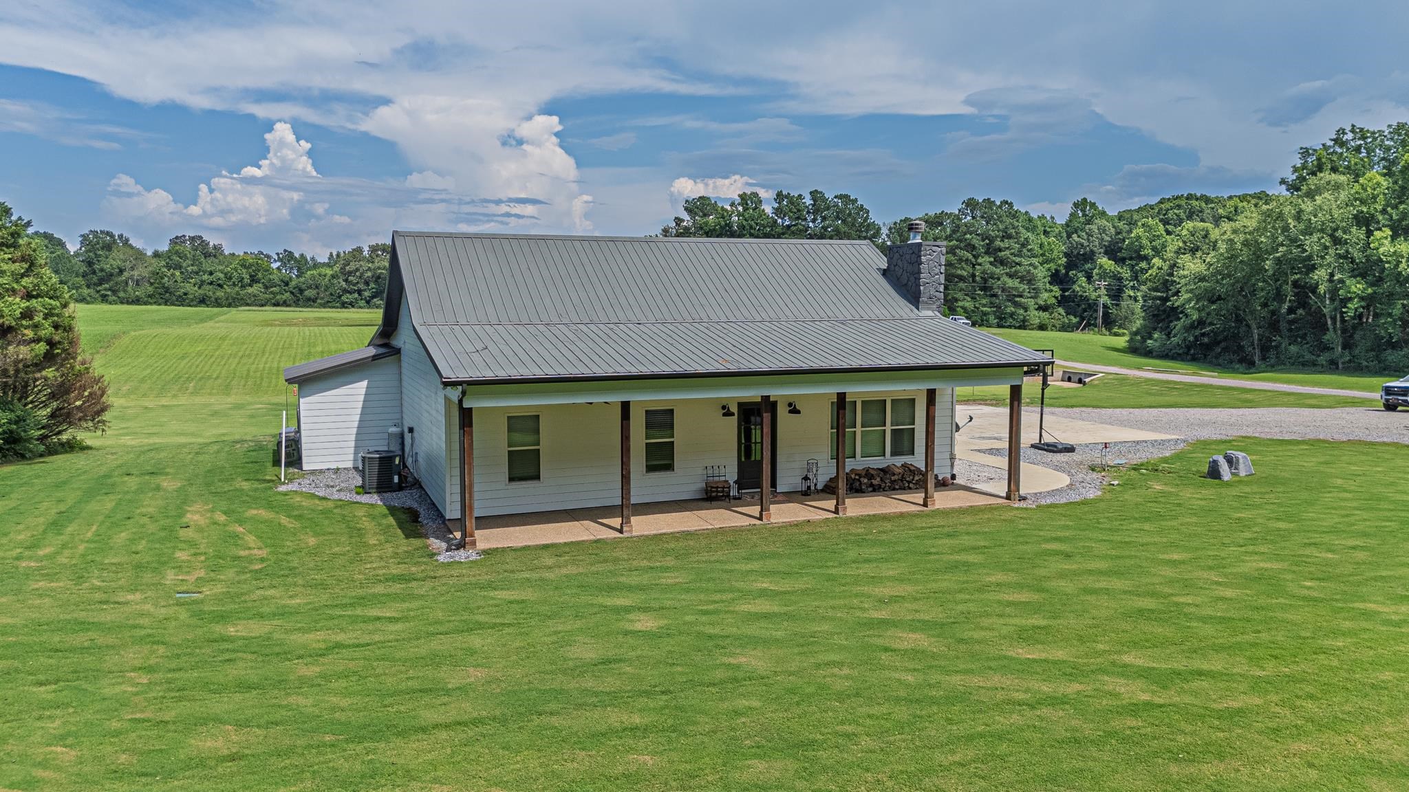 50 Shady Grove Road Williston, TN 38076 - Photo 5 of 35 a front view of a house with garden