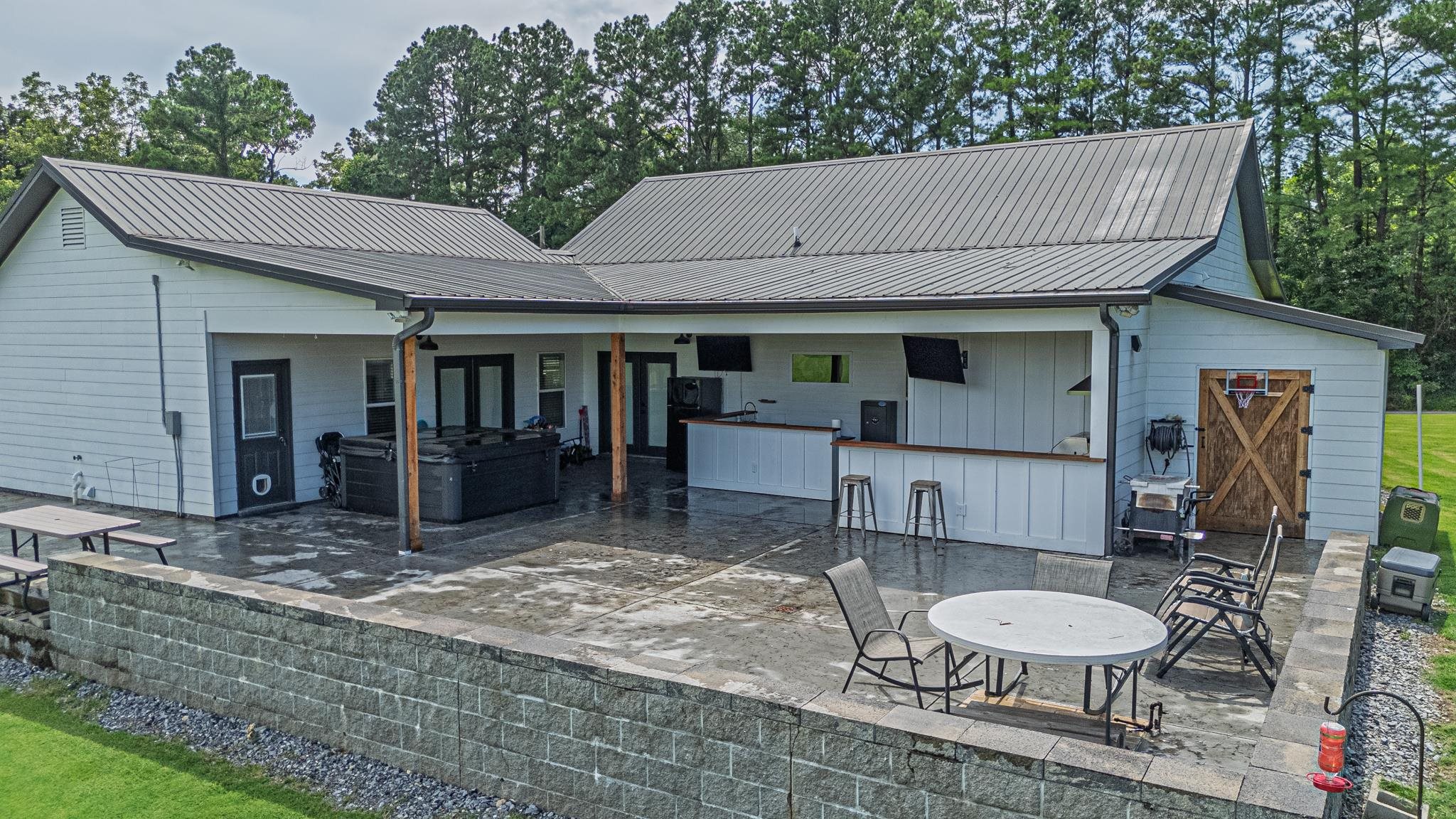 50 Shady Grove Road Williston, TN 38076 - Photo 8 of 35 a view of a patio with table and chairs with wooden floor and plants