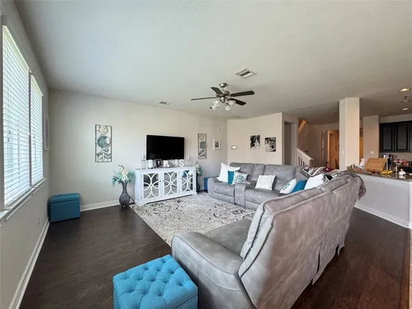 a living room with fireplace furniture and a flat screen tv