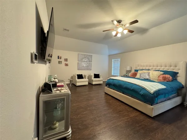 a large bathroom with a double vanity sink a mirror and a bathtub