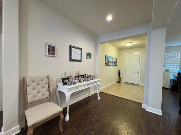 a view of kitchen with furniture and wooden floor