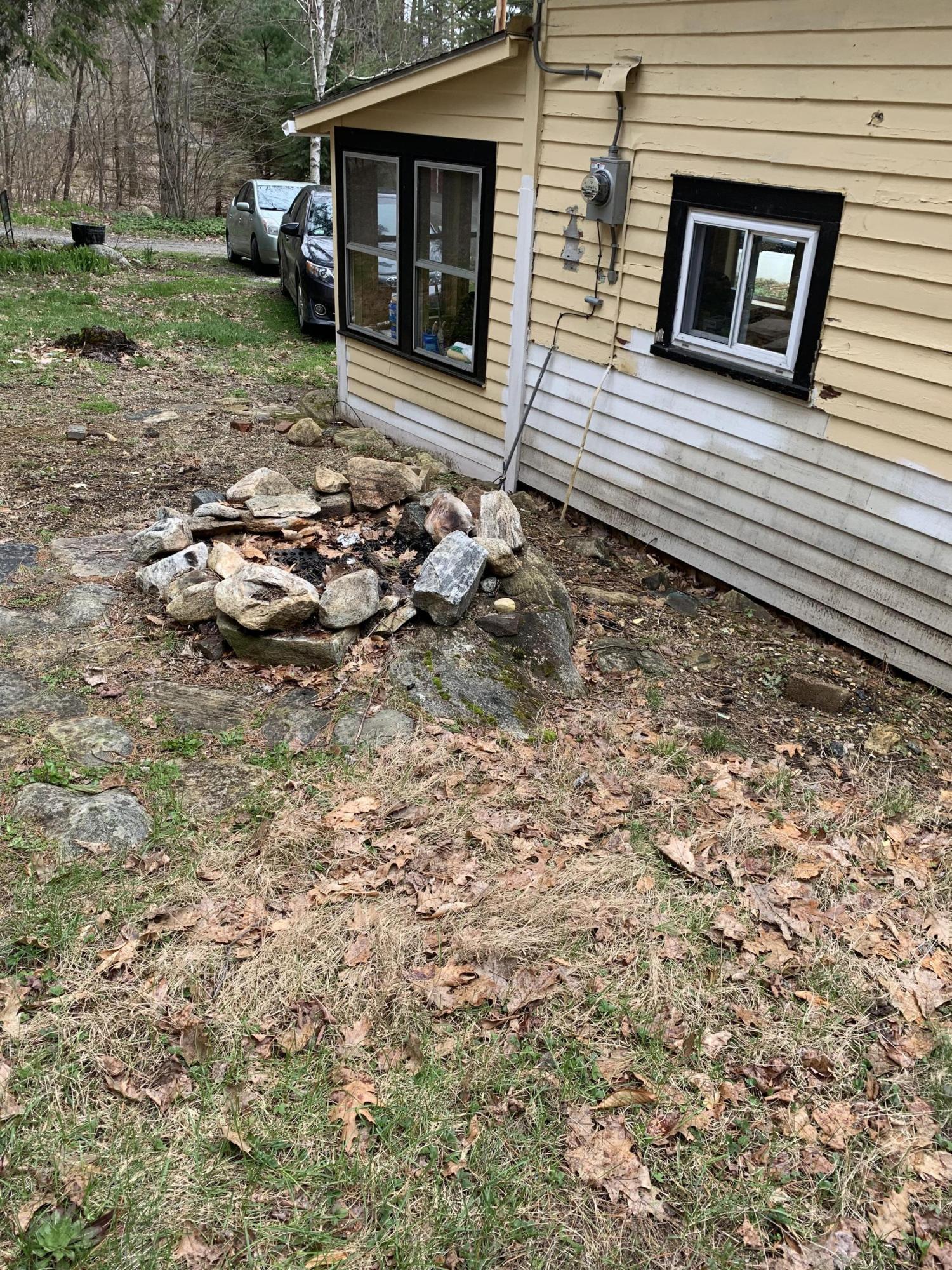 31 Lower Rainbow Road Otis, MA 01029 - Photo 11 of 15 a backyard of a house with barbeque oven