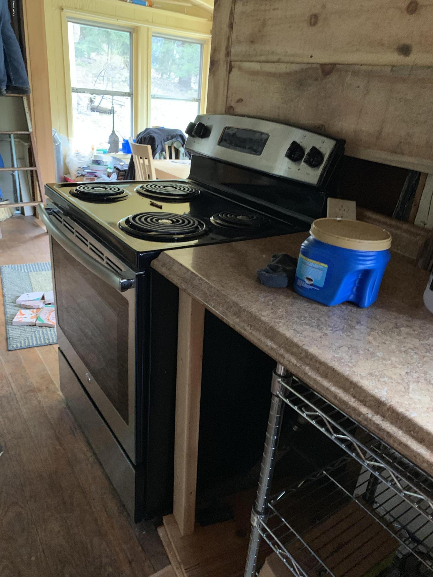 31 Lower Rainbow Road Otis, MA 01029 - Photo 3 of 15 a kitchen with a stove and a sink