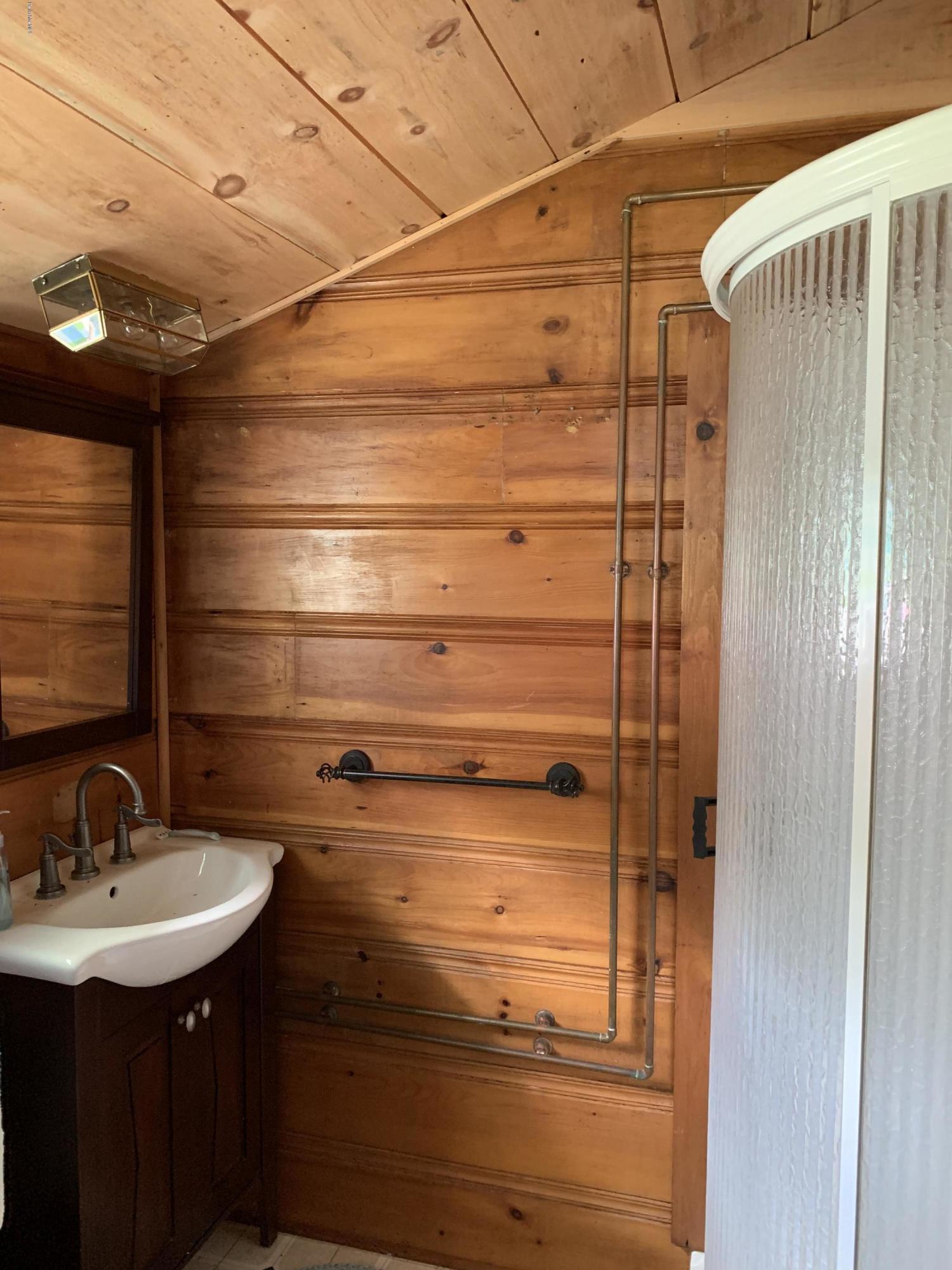 31 Lower Rainbow Road Otis, MA 01029 - Photo 7 of 15 a bathroom with a sink and mirror
