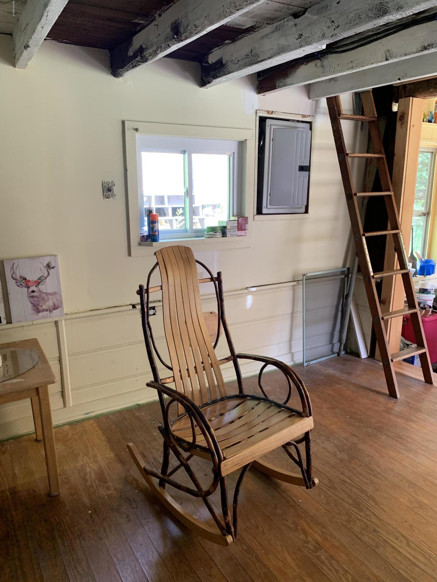 31 Lower Rainbow Road Otis, MA 01029 - Photo 8 of 15 a view of a room with furniture and wooden floor