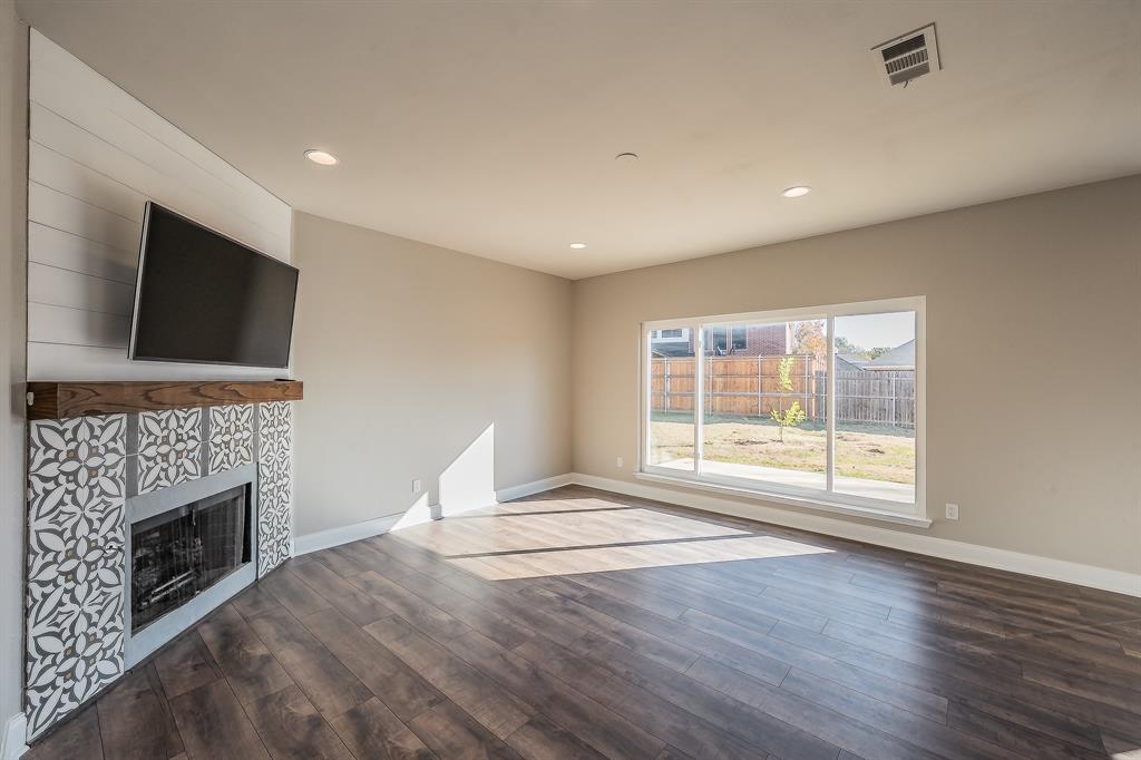7305 Raintree Way Denton, TX 76210 - Photo 12 of 32 a view of livingroom with furniture fireplace and window