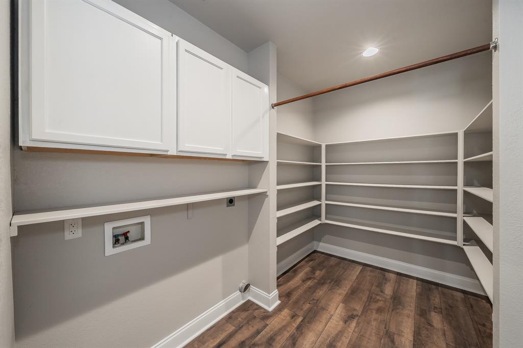 7305 Raintree Way Denton, TX 76210 - Photo 14 of 32 a view of walk in closet with empty racks