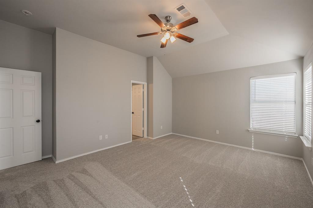 7305 Raintree Way Denton, TX 76210 - Photo 18 of 32 a view of an empty room with a window