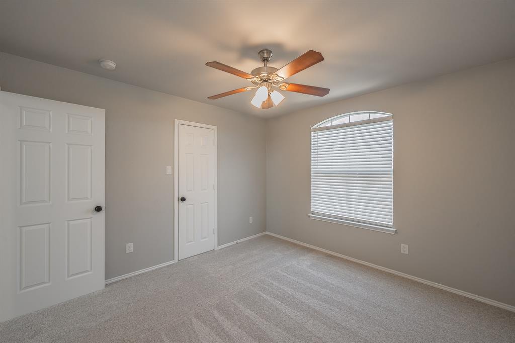 7305 Raintree Way Denton, TX 76210 - Photo 28 of 32 a view of an empty room with a window