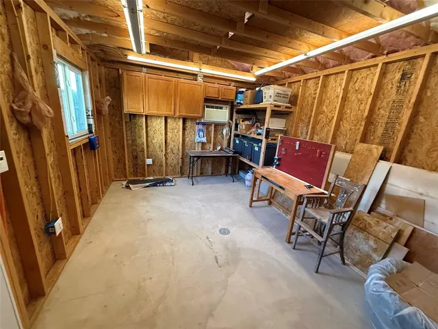 a view of a chairs in back of a building