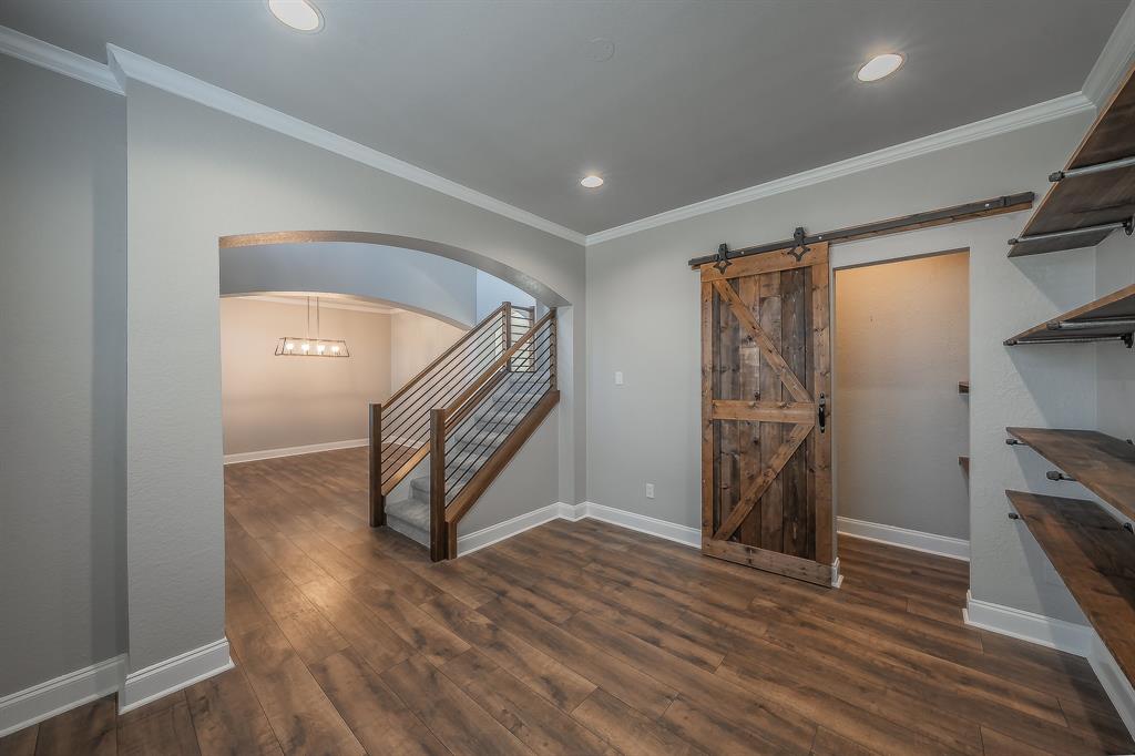 7305 Raintree Way Denton, TX 76210 - Photo 7 of 32 a view of entryway with wooden floor