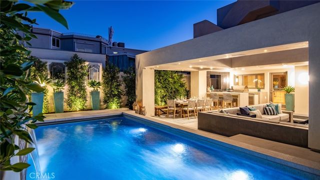 a bedroom with furniture and a potted plant