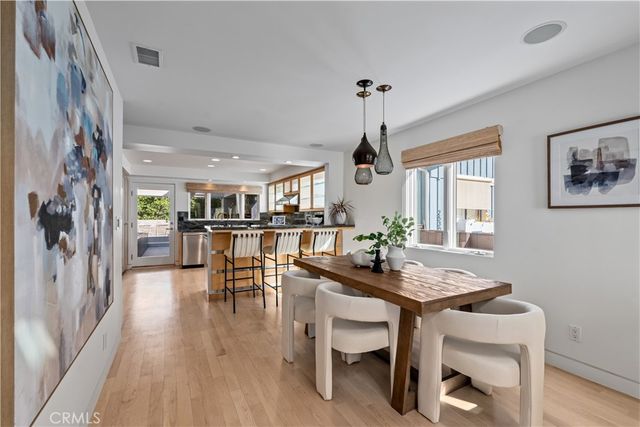 a bedroom with a large bed and a flat screen tv