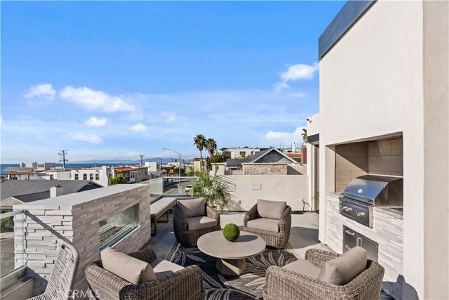 a living room with fireplace furniture and a flat screen tv